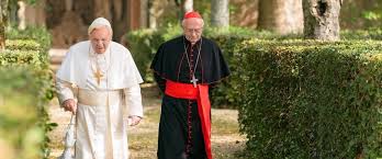 two popes walking